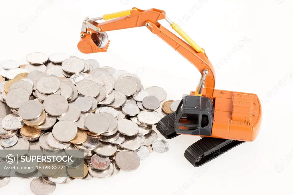 Excavator model and coins