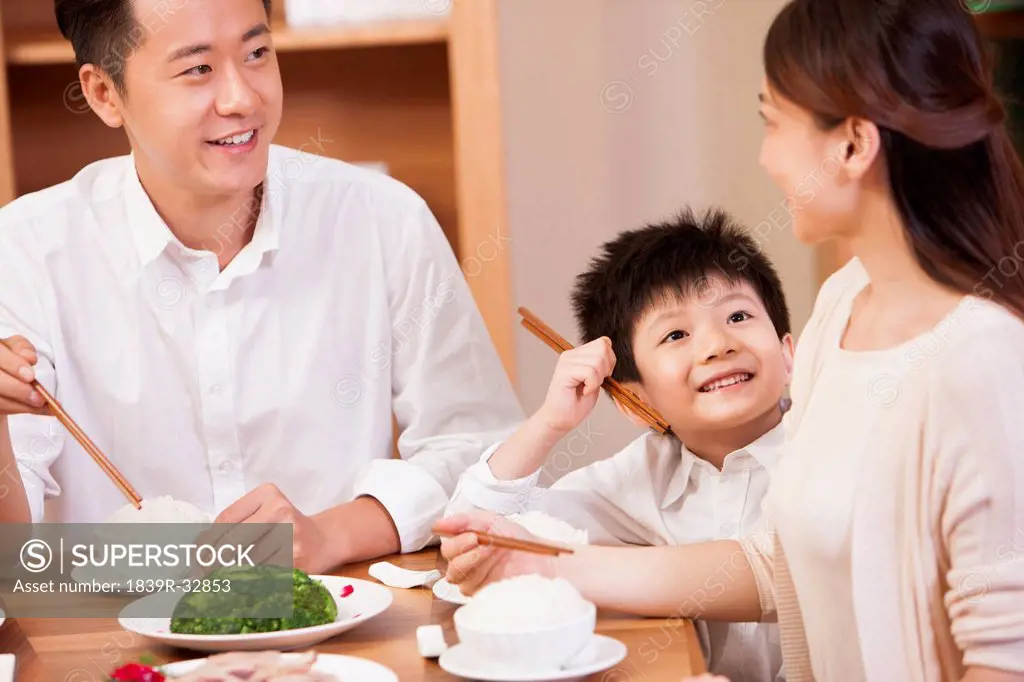 Happy family enjoying meal time