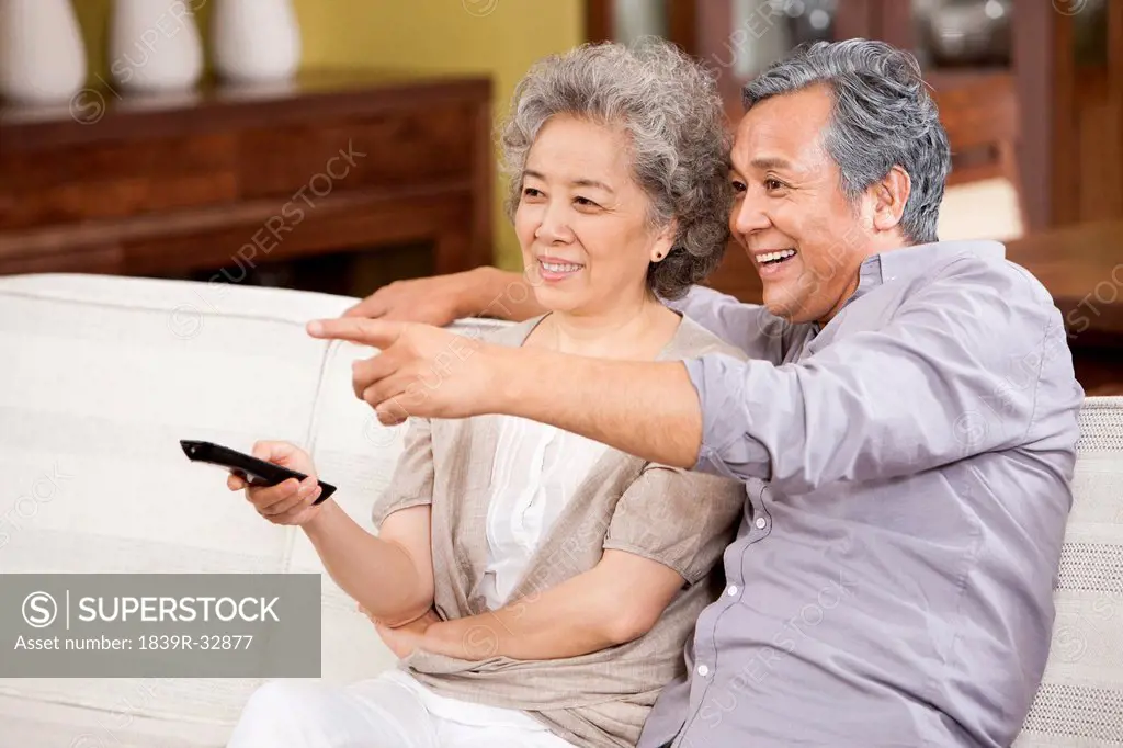Senior couple watching TV