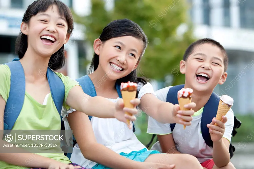 Happy schoolchildren and ice cream cones