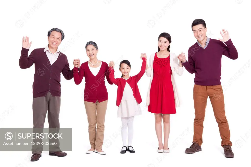 Cheerful family holding hands