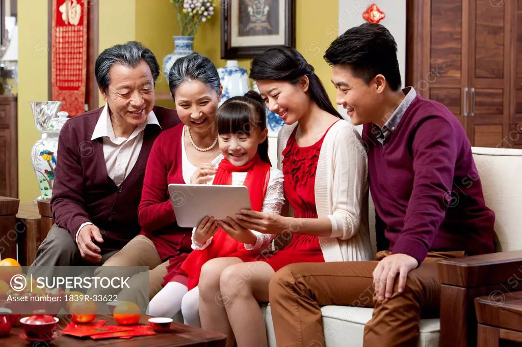 Family with digital tablet during Chinese New Year