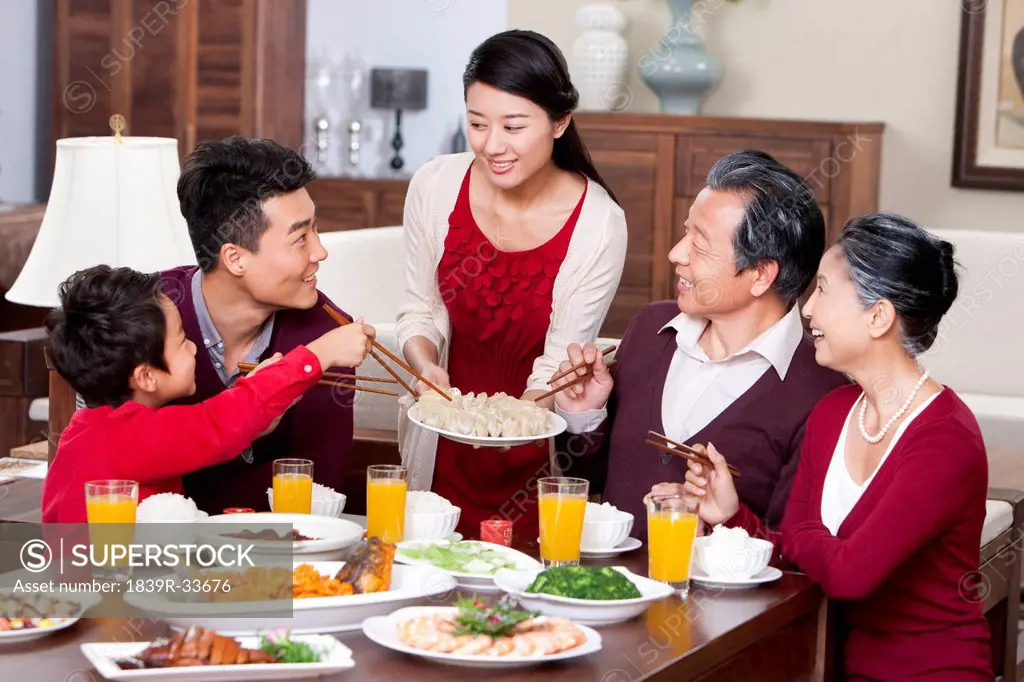 Merry family having Chinese New Year dinner