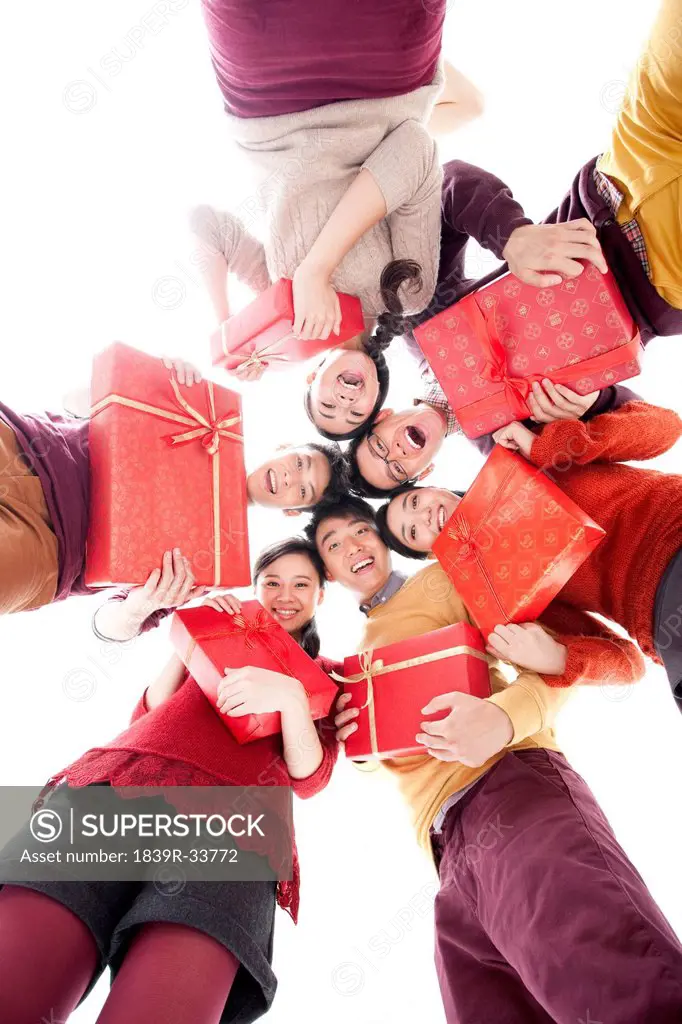 Happy young people with gifts in Chinese New Year