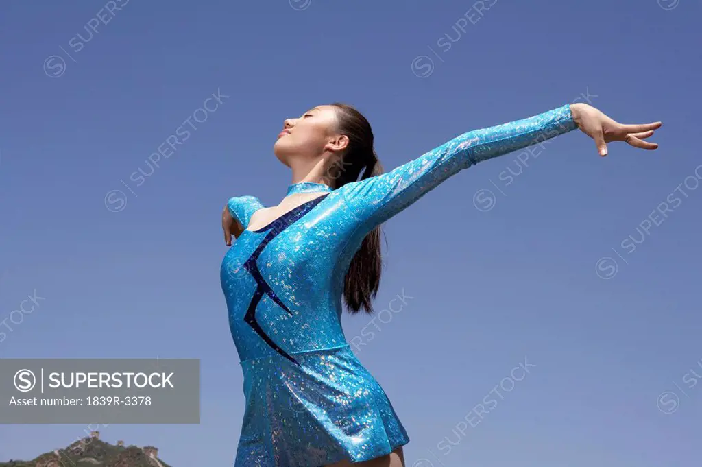 Woman Practicing Gymnastics On The Great Wall Of China