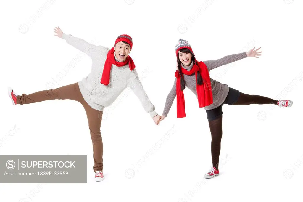 Excited young couple celebrating in Chinese New Year