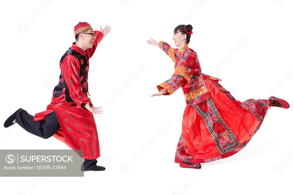Sweet couple in traditional Chinese clothing embracing