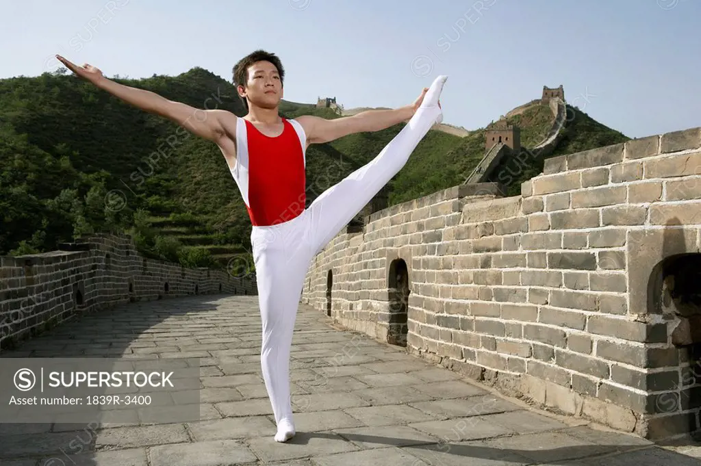 Gymnast Stretching On The Great Wall Of China