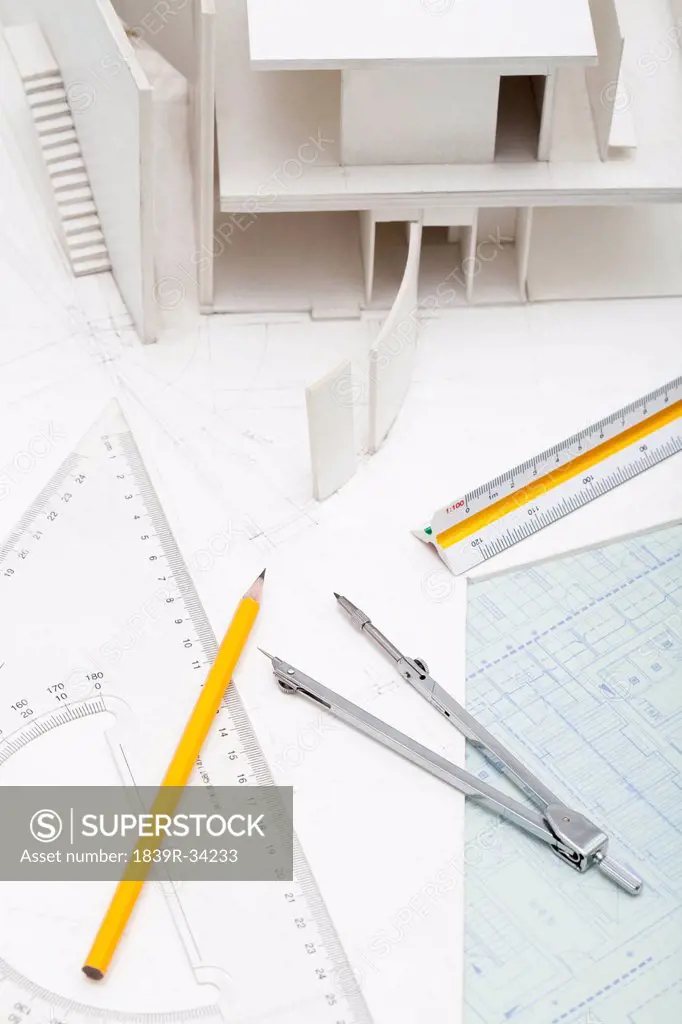 Office stationery and building model in design studio