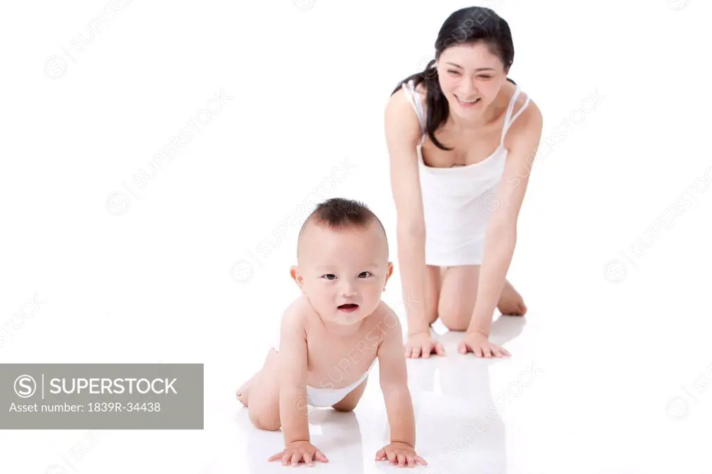 Joyful young mother with infant
