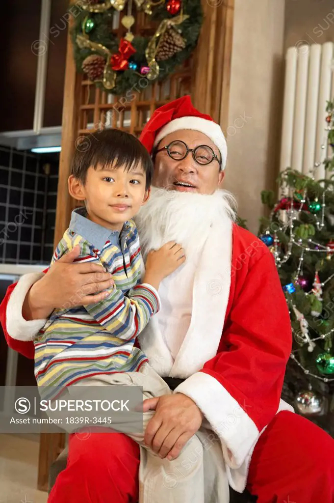 Boy Sitting On Santa Claus´ Lap