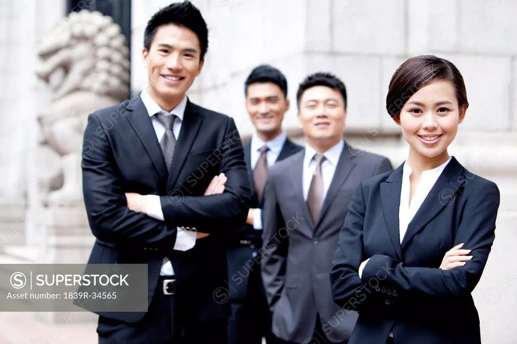 Portrait of confident business team outside a building, Hong Kong
