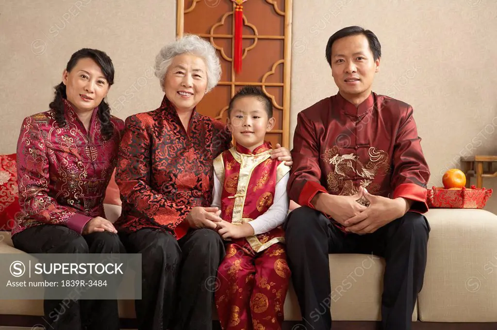 Portrait Of A Smiling Family Dressed In Traditional Clothing