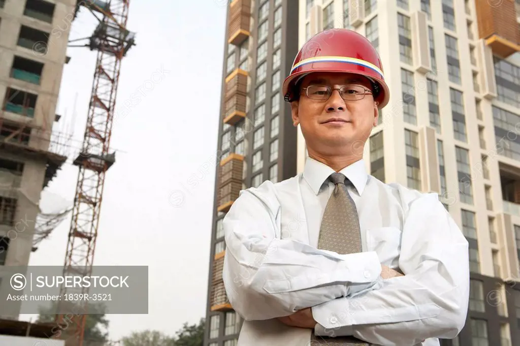 Construction Contractor Standing On Building Site