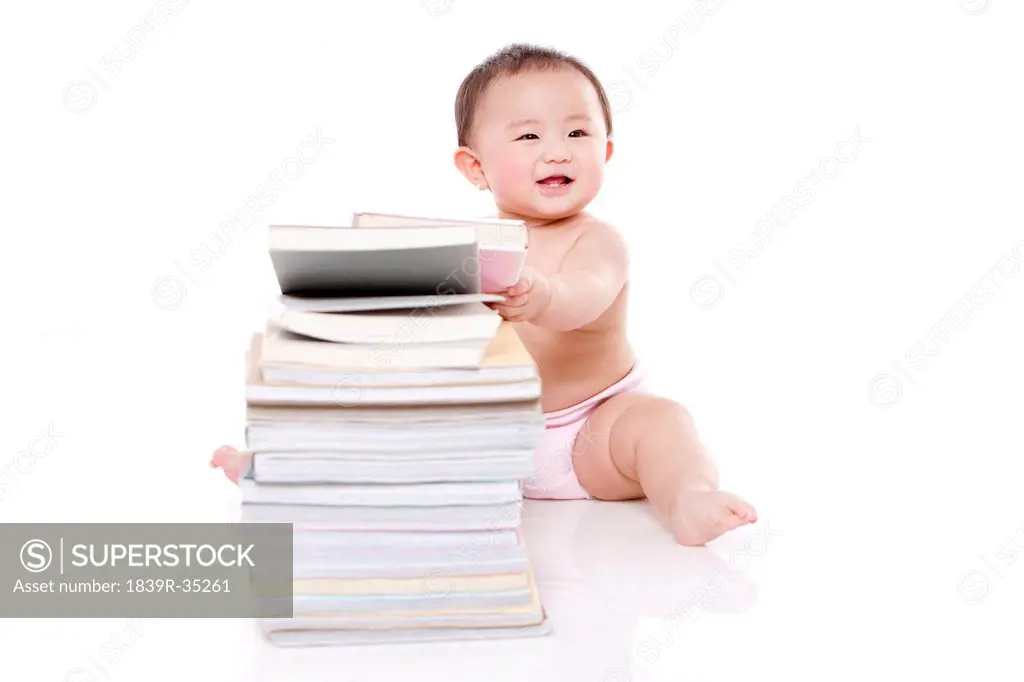 Smart baby girl with books