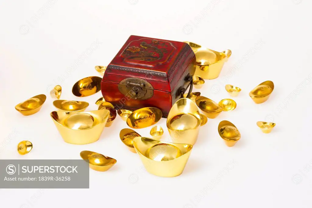 Chinese traditional currency gold yuanbao ingots and treasure chest