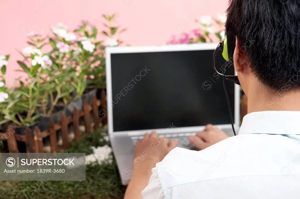 Businessman Typing On Laptop