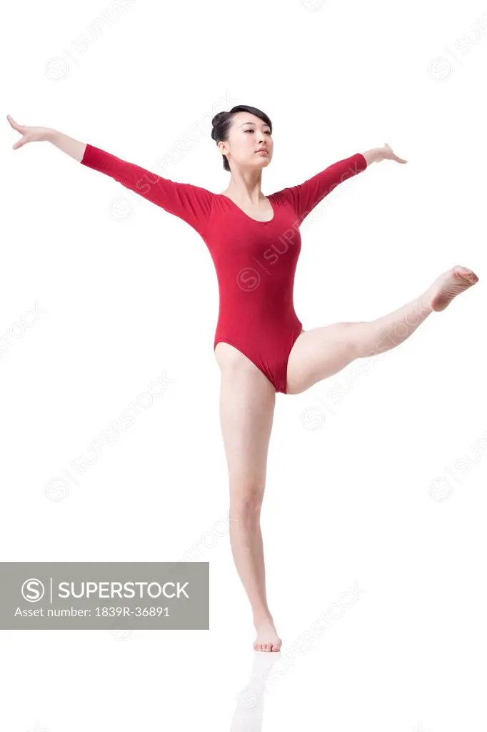 Female gymnast performing rhythmic gymnastics