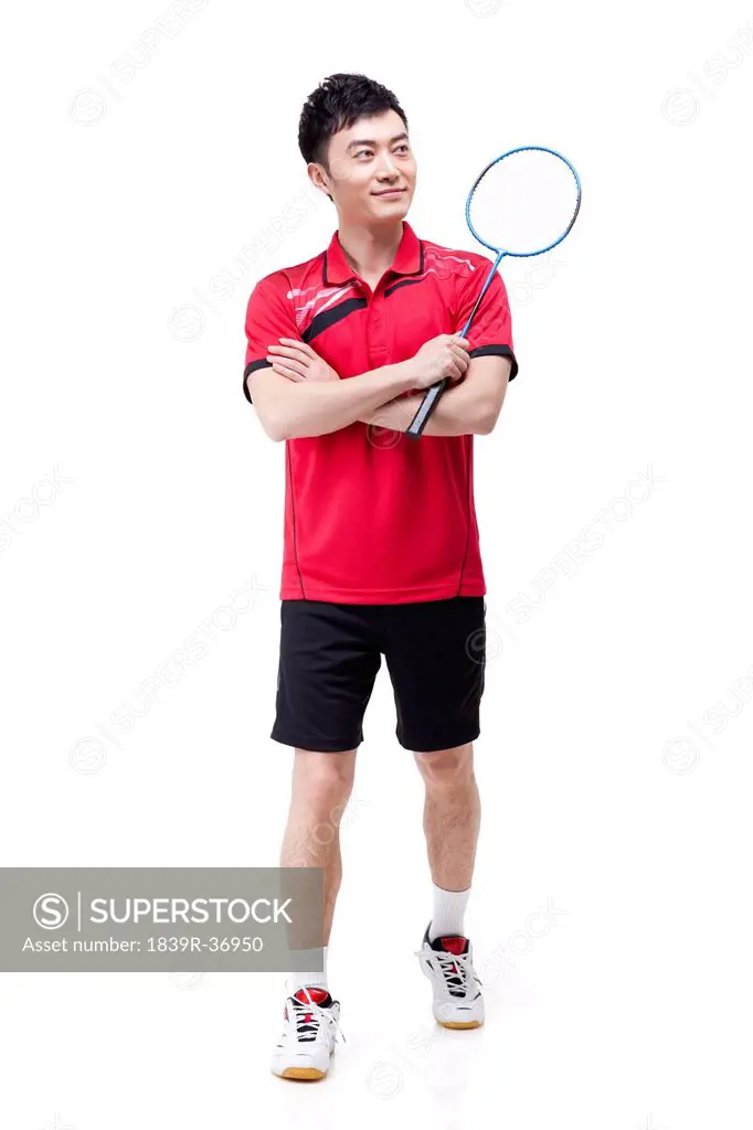 Portrait of male athlete with badminton racket