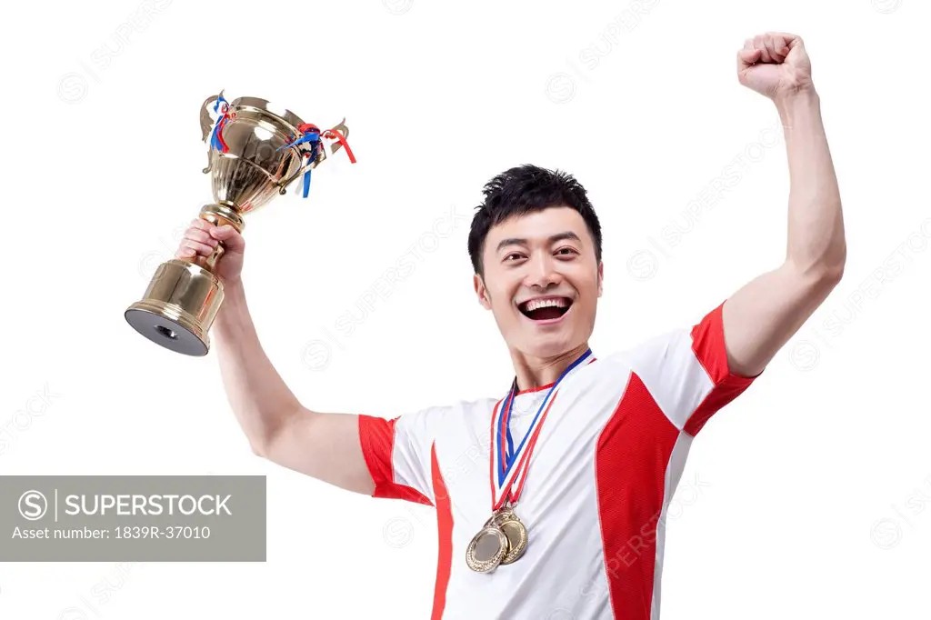 Athlete with trophy and medal