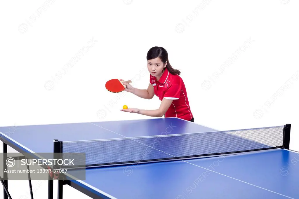 Female athlete playing table tennis