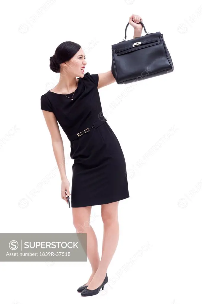 Angry businesswoman with brief case