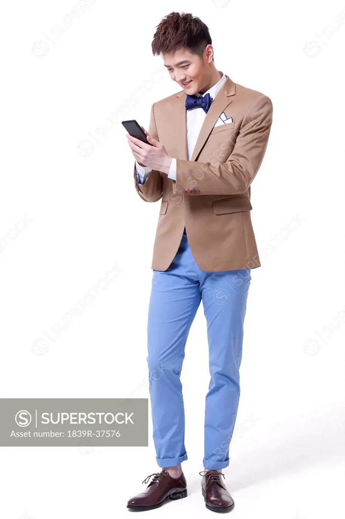 Fashionable businessman with smart phone