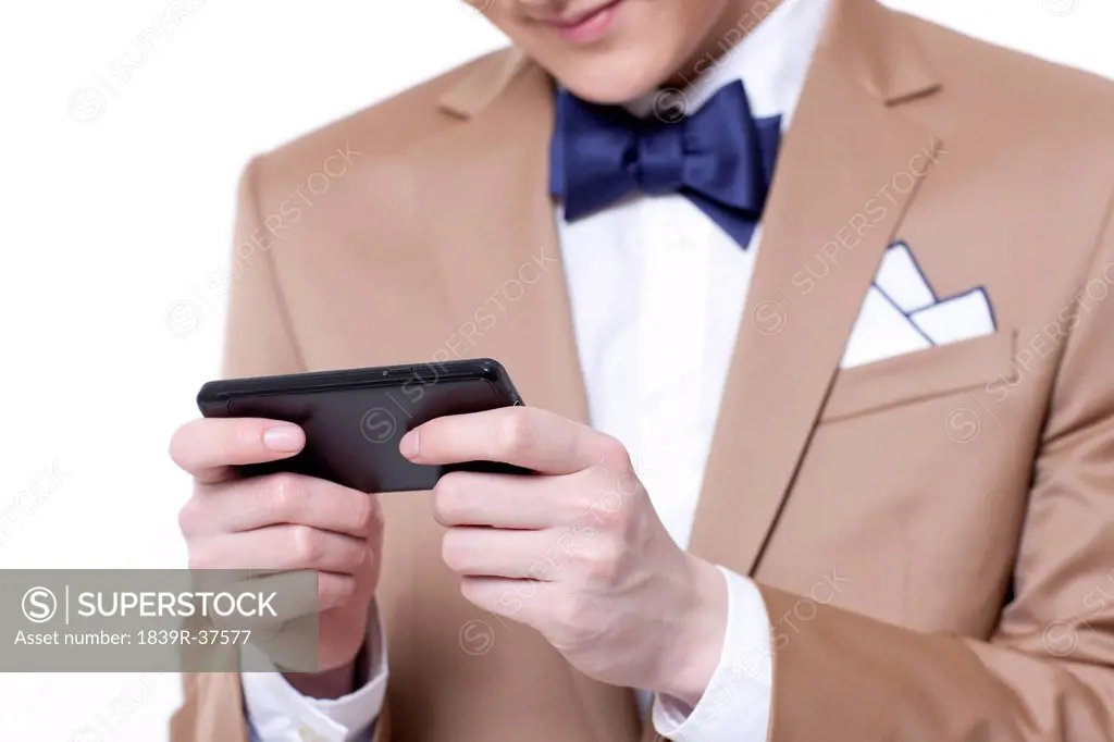 Stylish businessman using smart phone