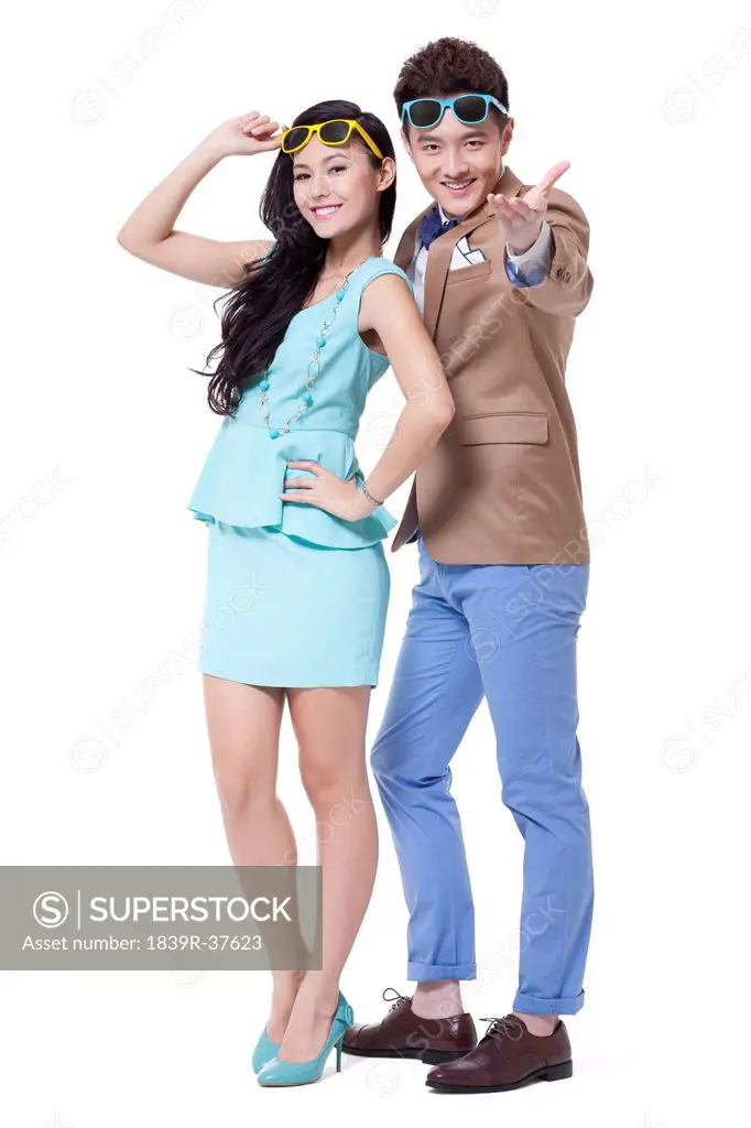 Trendy young couple with cool sunglasses