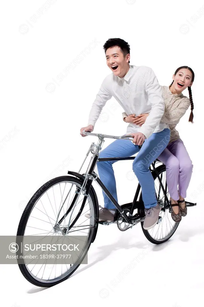 Young couple and bicycle in 1970s