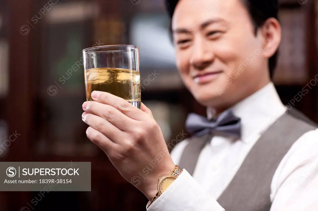 Businessman appreciating fine wine