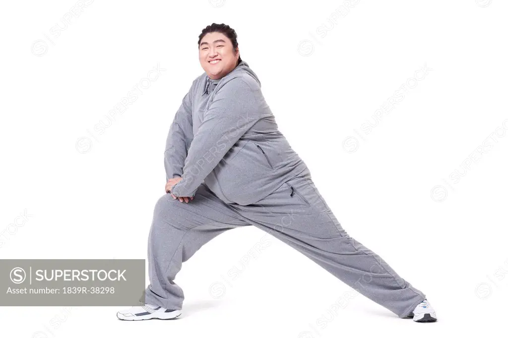 Overweight man exercising