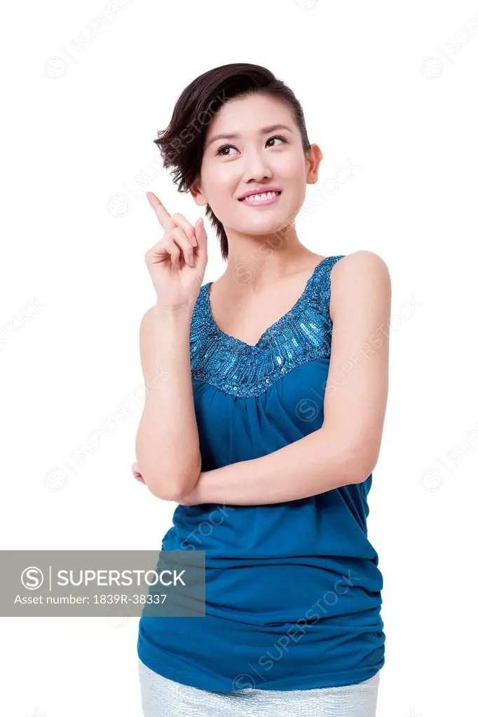 Happy young woman raising her finger