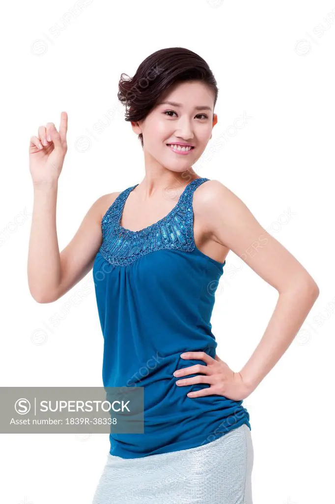 Happy young woman raising her finger
