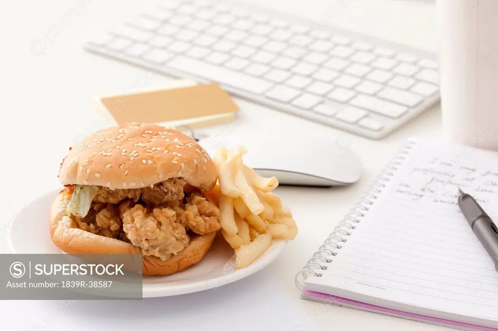 Fast food and other office items on desk