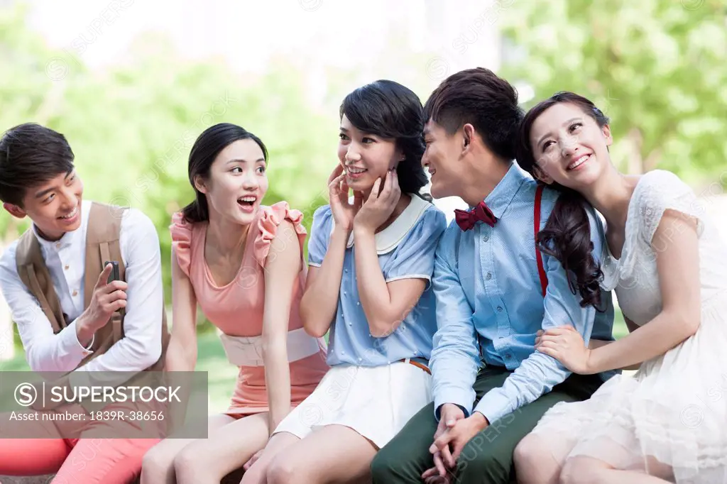 Stylish young people sitting together