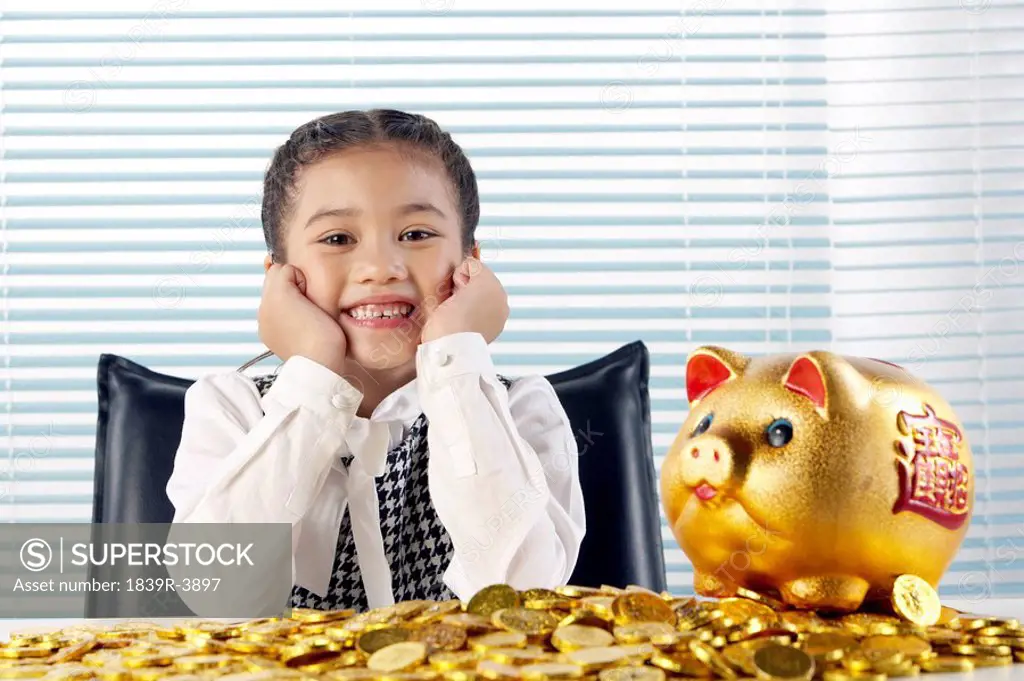 Young Girl With Gold Coins Smiling Happily