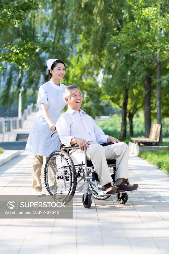Nurse with wheelchair bound patient