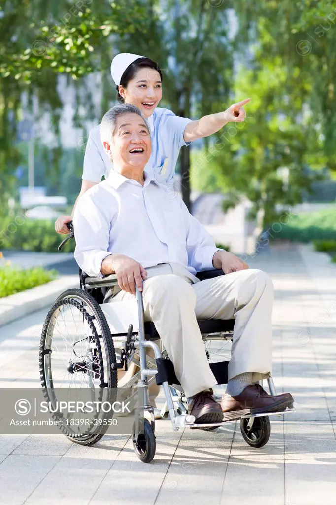 Nurse with wheelchair bound patient
