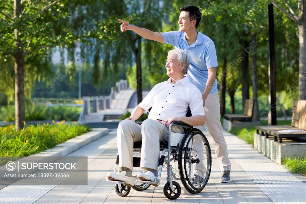 Wheelchair bound man with nursing assistant