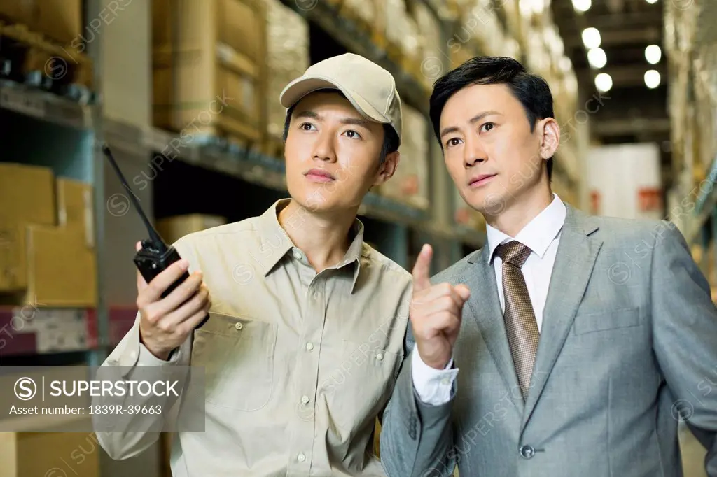 Young logistics staff with businessman