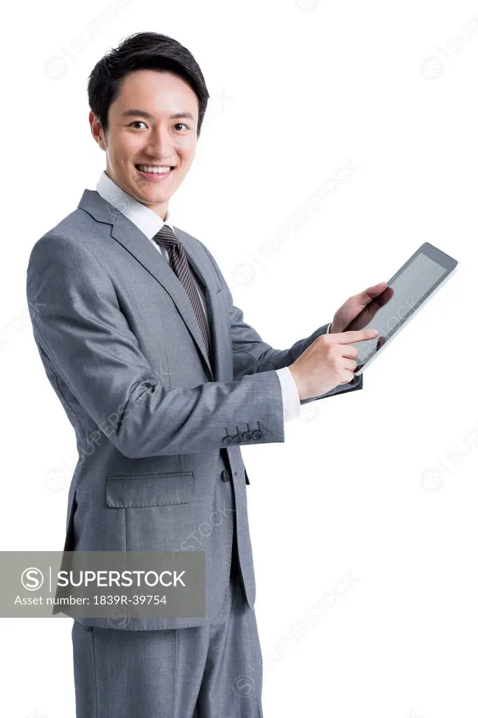 Young businessman with digital tablet
