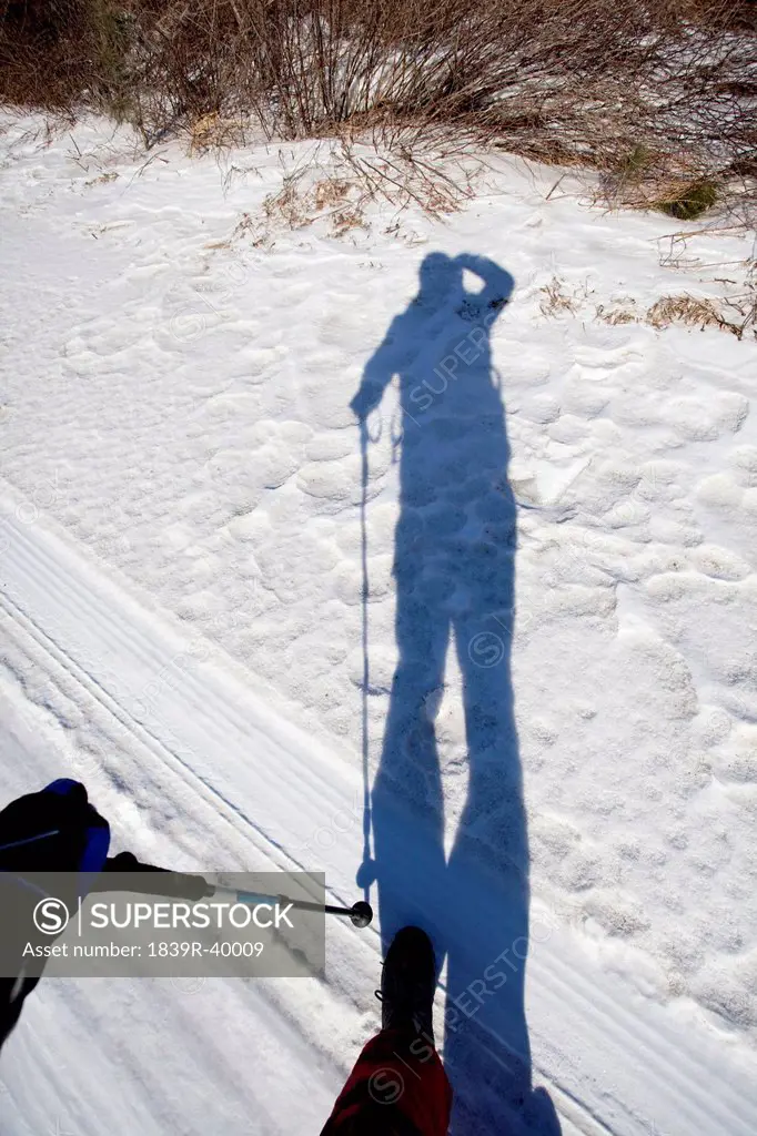 Shadow of climber in snowfield