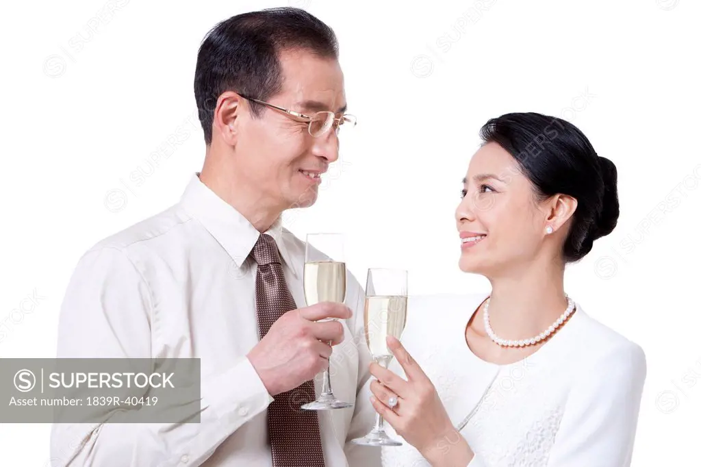 Happy mature couple cheers