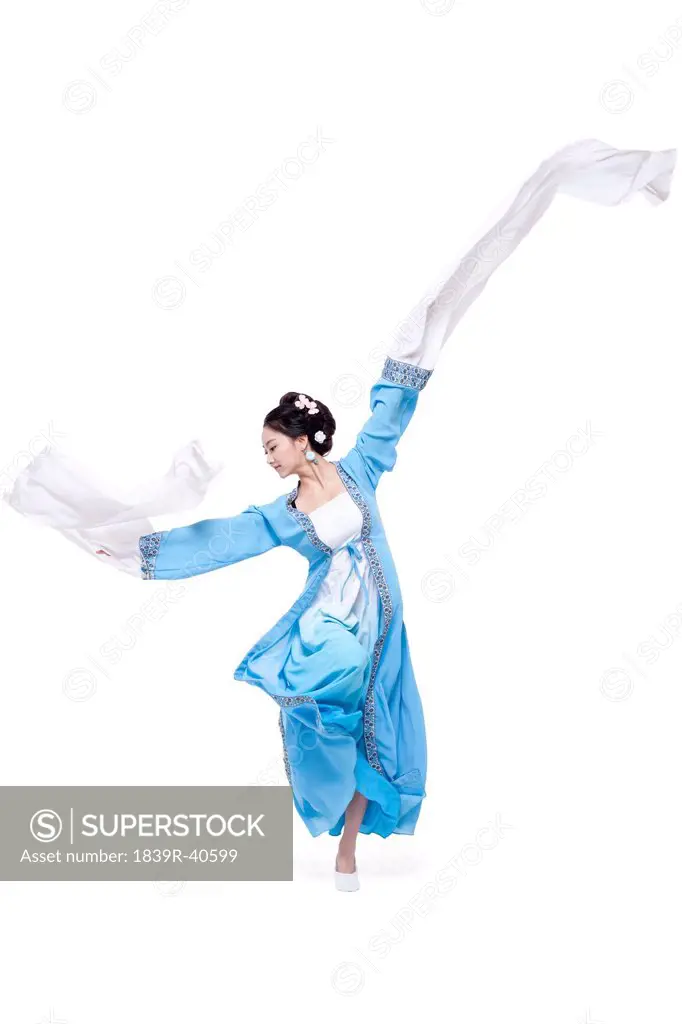 Young woman in traditional Chinese costume dancing