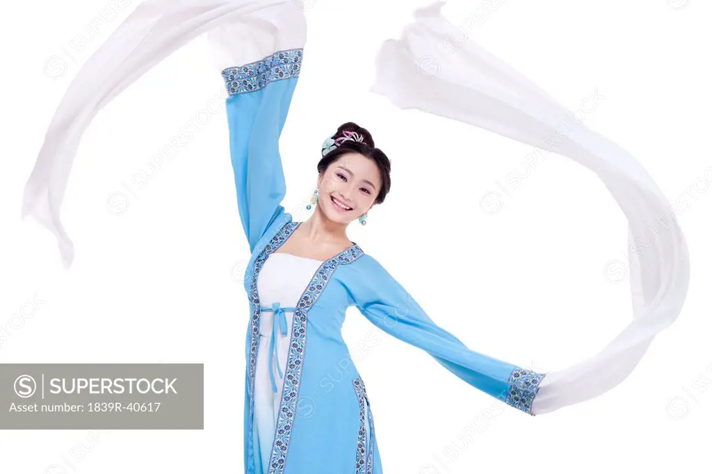 Young female dancer dancing in traditional Chinese costume