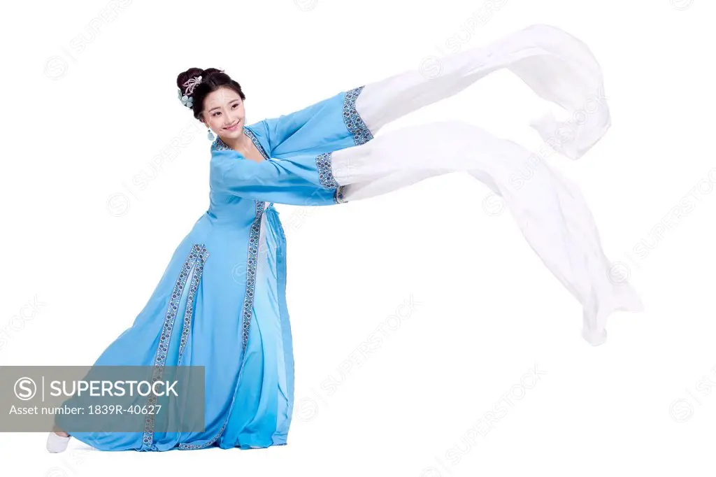 Happy young woman dancing in traditional Chinese costume