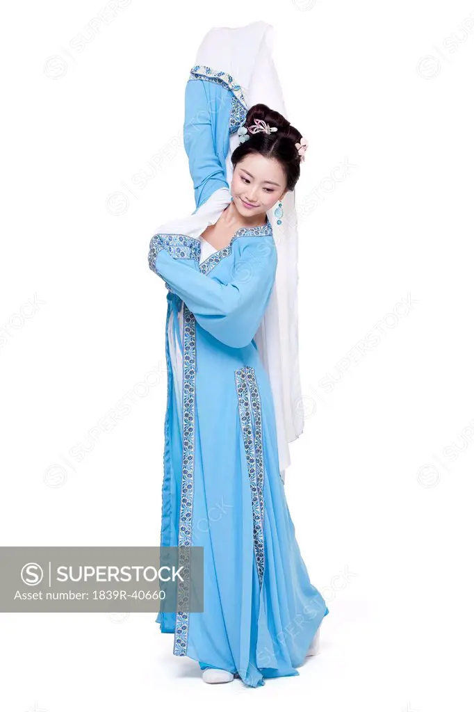 Young woman in traditional Chinese costume gesturing