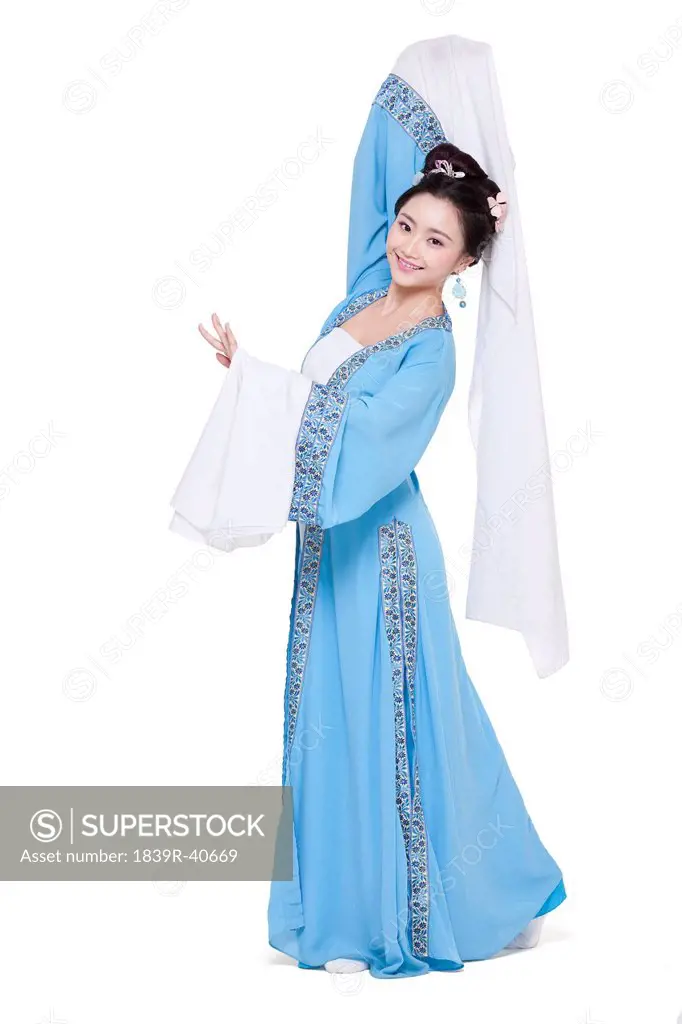 Young woman in traditional Chinese costume gesturing