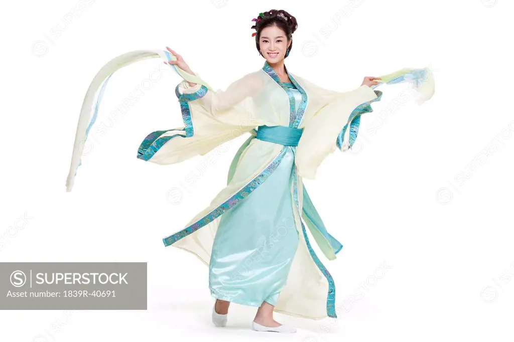 Young woman in Chinese traditional costume dancing